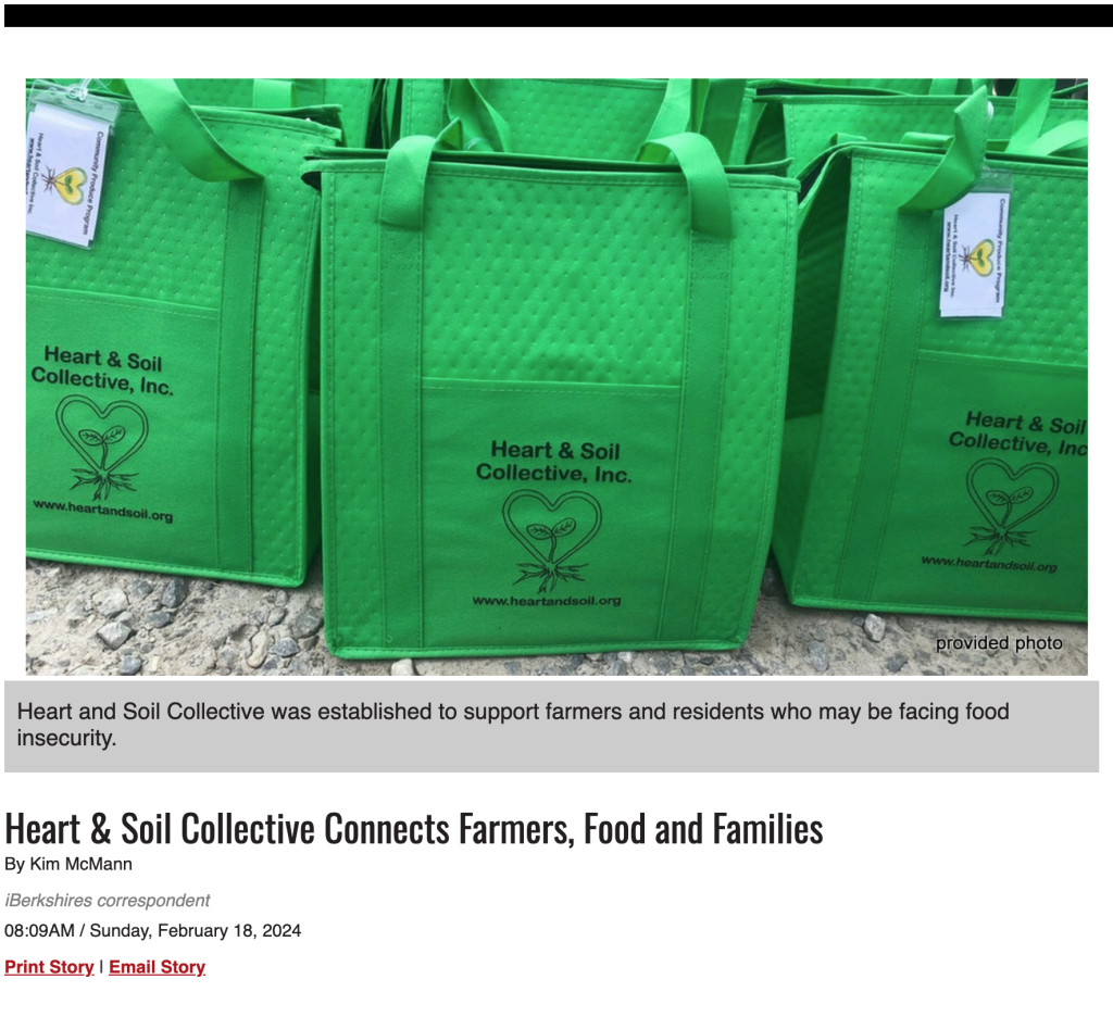 A row of bright green reusable bags from Heart & Soil Collective, featuring the organization's logo and website, arranged outdoors on a gravel surface.